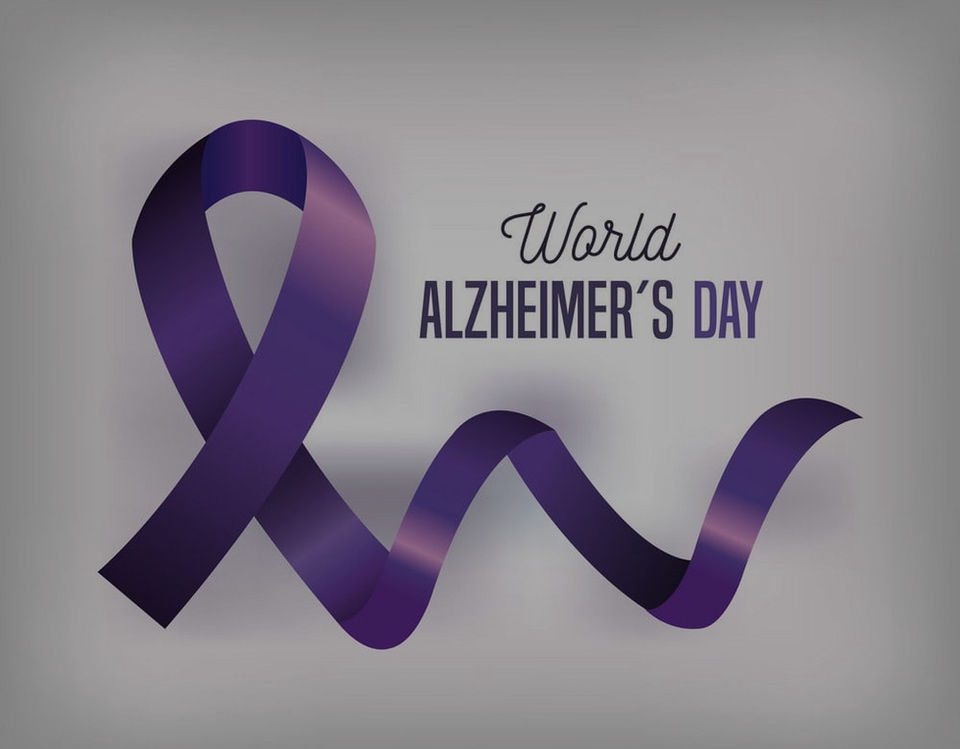 Family sitting together and reading Alzheimer’s resources